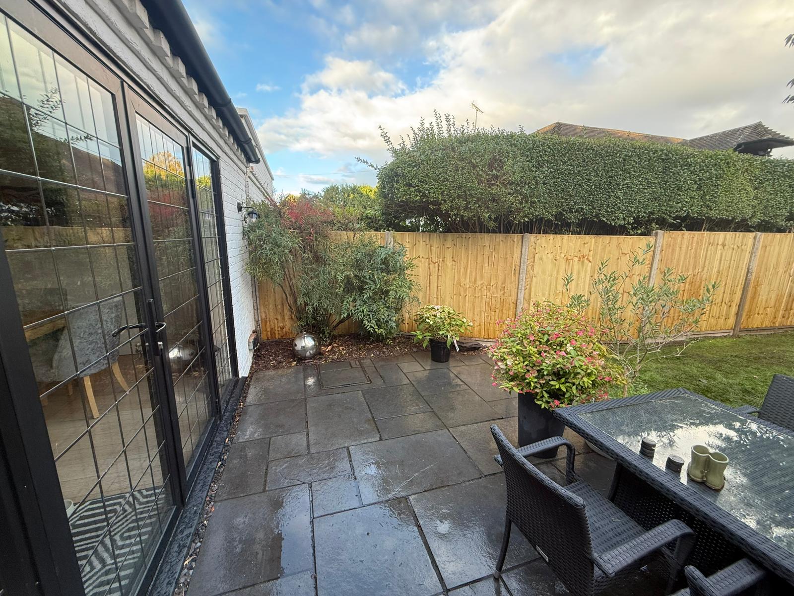 Closeboard fence with patio dining area